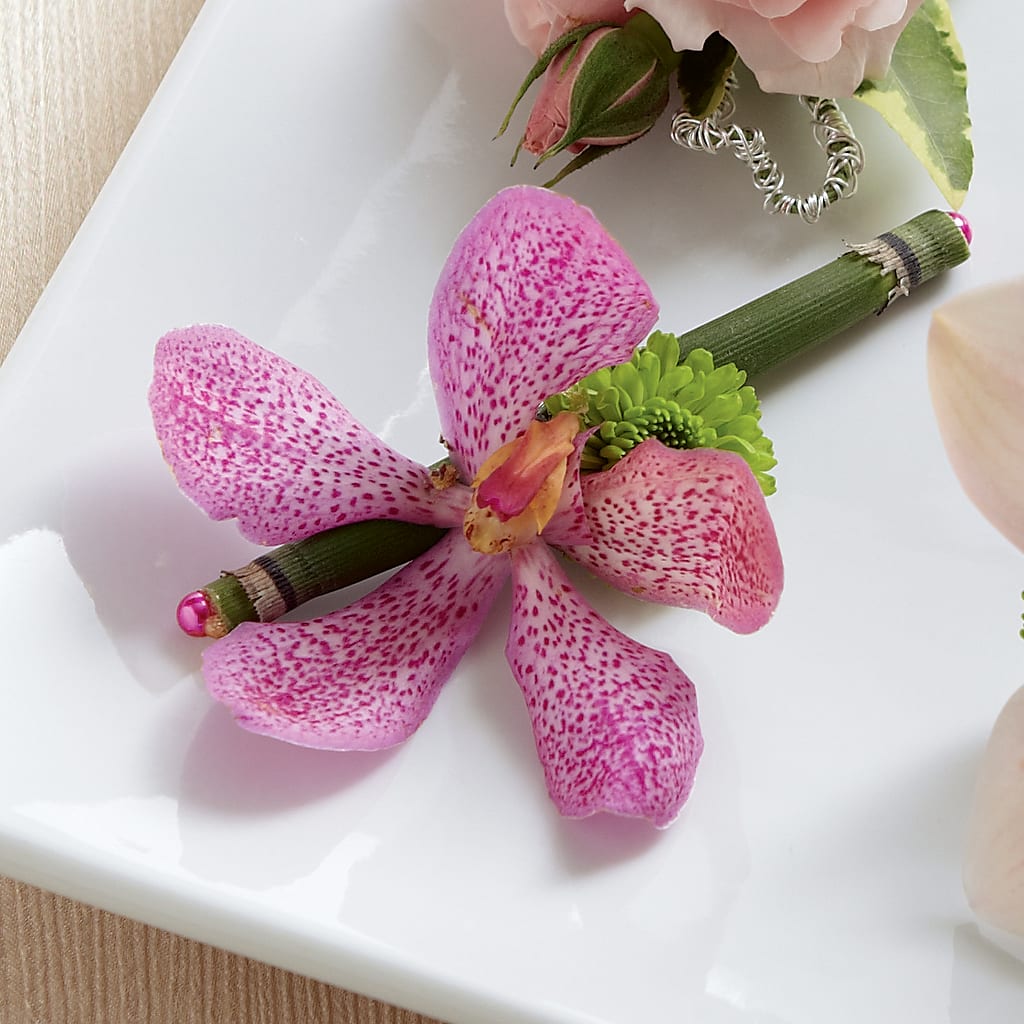 Pink Mokara Boutonniere – Rhea Flower Shop, Toronto ON