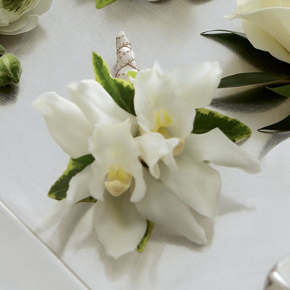 White Mini Cymbidium Boutonniere –  Rhea Flower Shop, Toronto ON